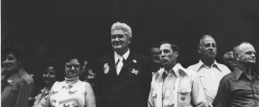 Documenters and Storytellers Exhibition Leon Levinstein, Man wearing Texas pin surrounded by people, n.d., gelatin silver print, 10 1/2 x 13 1/4 in., Scripps College, Gift of Geoffrey West