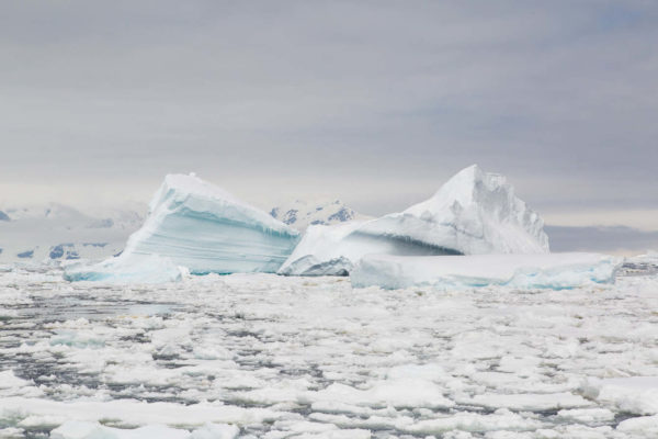 photograph of iceberg and sea