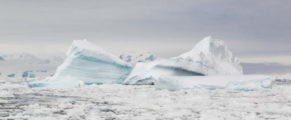 photograph of iceberg and sea